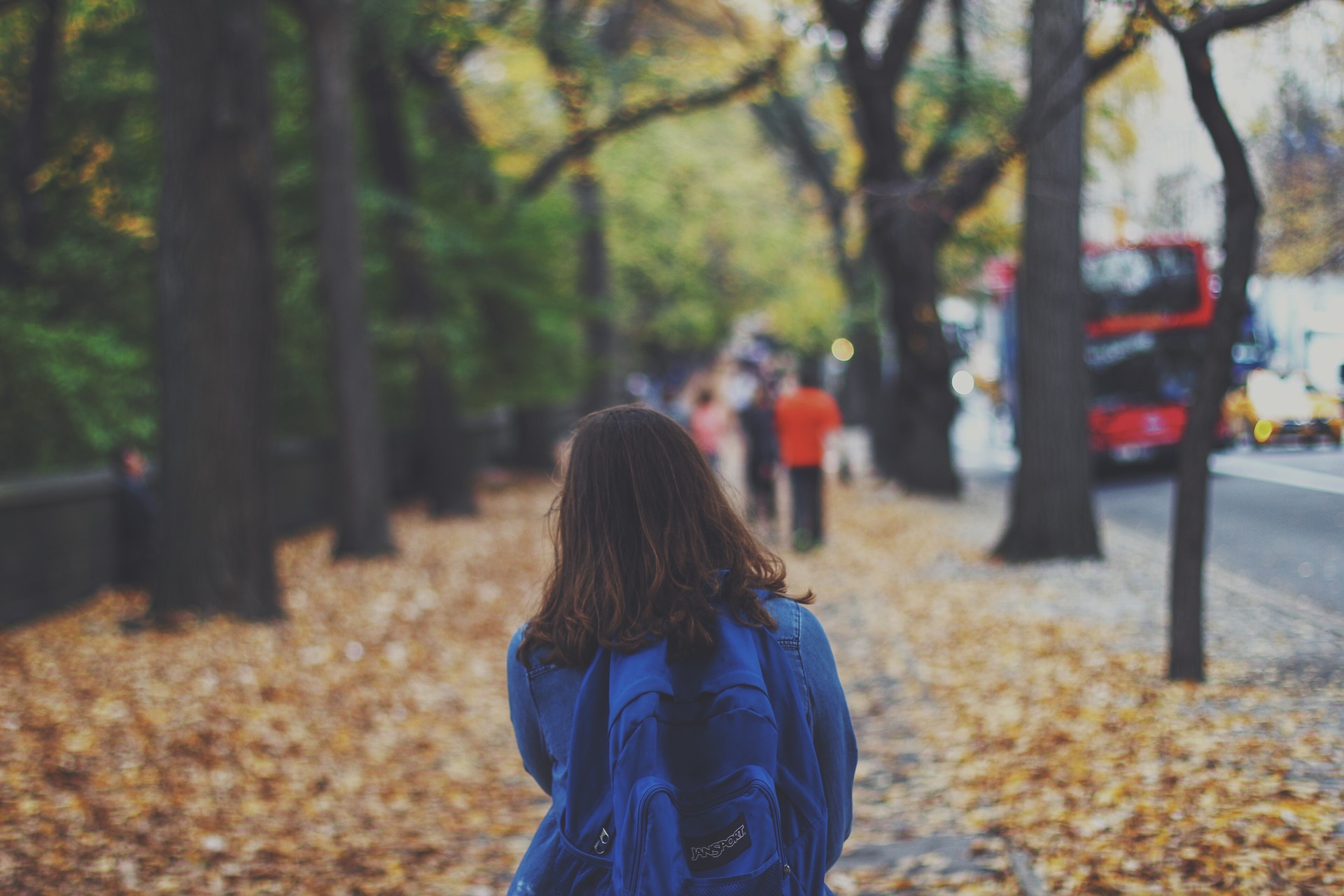 The picture shows a child with a backpack.