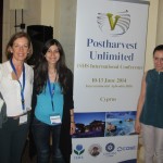 Maria Isabel Gil with Egli and Chrystalla in front of the Conference banner